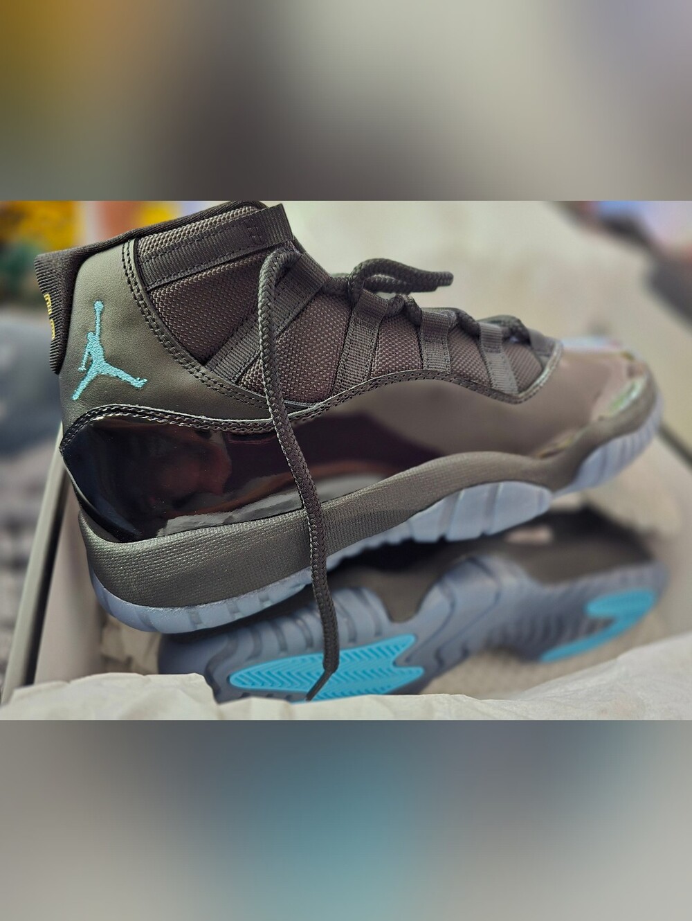Nike Air Jordan 11 Retro High-Top Sneaker in Black with Teal Accents